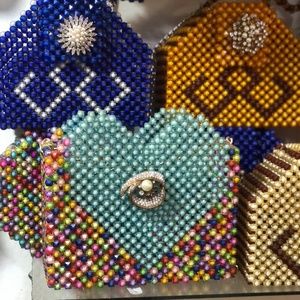Hand Beaded clutch with straps.